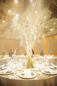 a table set with place settings, plates and silverware for an elegant wedding reception