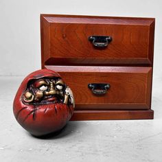 a wooden chest with two drawers and an open mouth