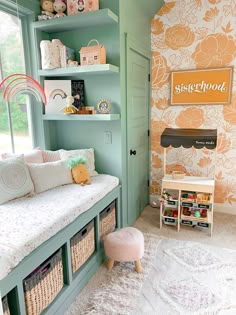 a child's room with green walls and floral wallpaper