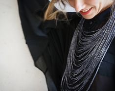 Looking great has never been easier than with this multi-strand black sparkly scarf necklace. It's the small details that make the biggest difference and this textile fashion statement is the perfect accessory to take your outfit from drab to fab! Now you too can rock this contemporary fashion detail from Frogaspect. Perfect for everyday or for evenings out, you can pair this infinity scarf necklace with a little black dress or it will look equally good on your office buttoned white shirt. Pair Sparkly Scarf, Ombre Necklace, Textile Fashion, African Necklace, Scarf Necklace, Silver Fabric, Fabric Necklace, Textile Jewelry, Textiles Fashion