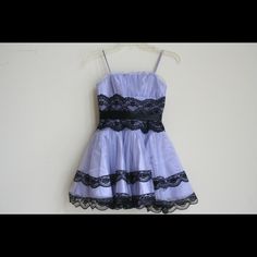 Jessica Mcclintock Girl’s Party Dress, Sz.8, In Mint Condition -Was Never Worn - Made In Usa - Lilac Satin With Mesh Overlay Is Embellished With Black Lace And Posh Satin Bow -Measurements Approx Are (Flat): Chest: 25”; Waist: 20; Length: 20.5” -Back Zip Closure -Sleeveless With Spaghetti Straps Shipped With Usps Priority Mail. Lavender Party Dress With Lace Trim, Bow Measurements, Jessica Mcclintock, Mesh Overlay, Satin Bow, Flat Chest, Kids' Dresses, Purple And Black, Priority Mail