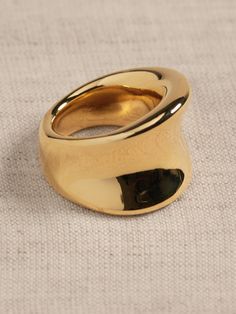 Our gleaming golden ring is formed with a highly reflective polished channel.  Timeless Classics: Luxury, everyday.  A showcase of time-honored craftsmanship and skilled Italian artisans, these are the pieces you'll reach for season after season, delighting in their exceptional versatility and endless appeal.  12K-gold plated or silver-plated bronze.  Made in Italy.  Length: 0. 7"