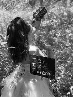 a woman in a dress with a sign on her head