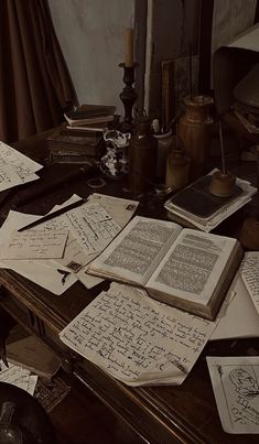 an old desk covered with lots of papers and writing on top of eachother