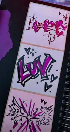 graffiti on the side of a wall next to a spiral notebook with pink and purple writing