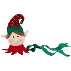 a stuffed toy elf with a green hat and red scarf