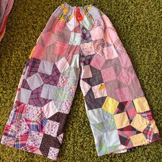 a colorful patchwork pants laying on the ground