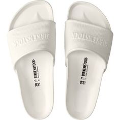 We love slipping on our Barbados Sandal after hopping into the pool. This sandal delivers all of the comfortable qualities of a Birkenstock original cork sandal, except this one is made with waterproof and mega lightweight materials, making it a great travel and beach companion. Summer Outdoor Slides With Cork-bed Midsoles, Summer Slides With Branded Insole In Synthetic Material, Comfortable White Slides With Cork-bed Midsoles, Casual White Slides With Cork-bed Midsoles, White Slip-resistant Sandals For The Beach, White Slides With Cork-bed Midsoles For Beach, White Summer Slides With Textured Footbed, White Textured Footbed Summer Slides, White Textured Slides For Summer