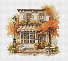 a cross stitch pattern with an image of a coffee shop in the middle of autumn