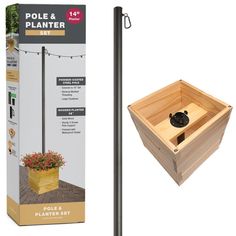 the pole and planter set is made out of wood, with a wooden box on top