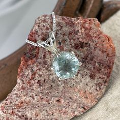 "Natural Aquamarine Pendant - Sterling Silver Pendant - Natural Aquamarine Necklace: This sterling silver pendant features a natural Aquamarine stone. The Aquamarine is 8mm in diameter and weighs 1.9 ct.. The setting is 12mm x 8mm (1/2\" x 1/4\"). The stone and setting are suspended from the included, complimentary 18\" sterling silver rounded box chain. The stone has a gorgeous light blue color that really pops in this setting! Aquamarine is March's birthstone and when paired with a matching pa Fine Jewelry Gemstones With Large Stone Gift, Sterling Silver Gemstones For Gifts, Large Stone Fine Jewelry Gemstone Gift, Sterling Silver Gemstones For Gifts With Round Stone, Sterling Silver Gemstone With Large Stone For Gifting, Anniversary Necklace With Large Round Pendant Stone, Anniversary Necklace With Large Round Pendant, Sterling Silver Gemstone With Large Stone For Gift, Anniversary Necklace With Large Round Stone