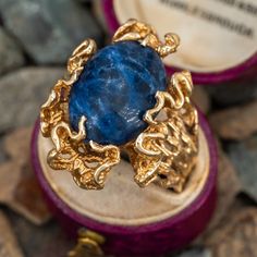 This vintage freeform ring features an oval cabochon cut sodalite gemstone set in the center of ribbon style gold work that mimics ocean waves. The ring is crafted in 14k yellow gold and is currently a size 11. Jewelry Smithing, Sodalite Ring, Freeform Ring, Ribbon Style, Vintage Waves, Gold Work, Oval Cabochon, Ocean Waves, Jewelry Rings