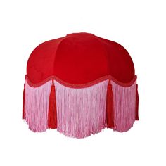 a red and pink hat with fringes on it