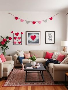 a living room filled with furniture and pictures on the wall above it's coffee table