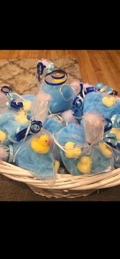 a basket filled with blue and yellow stuffed animals