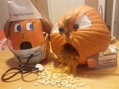 two pumpkins that have been carved to look like doctors