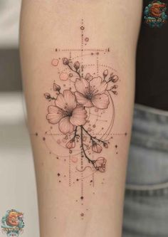 a woman's arm with flowers on it