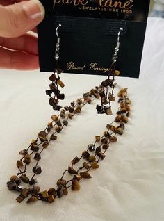 Park lane Tigress necklace and earrings set genuine tiger eye stones 16 inch plus 3 inch extending and pierced earrings Retailed for $73 Pink Yarn, Necklace And Earrings Set, Park Lane, Tiger Eye Stone, Thread Crochet, Pearl Chain, Necklace And Earrings, Pierced Earrings, Earrings Set