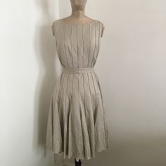 Calvin Klein Linen Dress. Color Taupe. Size 6. Dry Clean Only. Never Been Worn. Brand New Tags Still Attached. Spring Sleeveless A-line Dress With Pleated Back, Beige A-line Lined Midi Dress, Fitted Beige Pleated Midi Dress, Spring Knee-length Box Pleat Dress, Spring Knee-length Dress With Box Pleat, Classic Sleeveless Dress For Spring Party, Spring Fitted Sleeveless Pleated Dress, Elegant Pleated Cotton Mini Dress, Fitted Pleated Sleeveless Dress For Spring