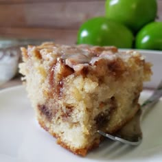 a piece of cake sitting on top of a white plate with a fork in it