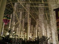 the inside of a building decorated with lights