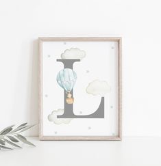 the letter j is for hot air balloon with clouds and stars on it, next to a potted plant