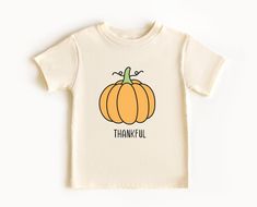 So cute Toddler Thanksgiving Shirt.  Eco friendly Uplift any child's wardrobe with a custom kid's t-shirt. The Bella Canvas short sleeve tee for toddlers is a 100% Airlume combed and ring-spun cotton jersey with a tear-away label for extra comfort. Cozy and soft, your toddlers will happily wear every day.  .: 100% Airlume combed and ringspun cotton  .: Extra light fabric  .: Tear-away label Toddler Thanksgiving Shirt, Toddler Thanksgiving, Dinner Thanksgiving, Thankful Shirt, Turkey Shirts, Thanksgiving Shirt, Pumpkin Shirt, Thanksgiving Shirts, Thanksgiving Outfit