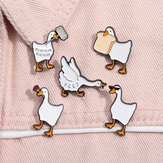 four ducks and one duckling are on a white line with a pink shirt in the background