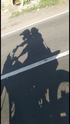 the shadow of a person on a motorcycle