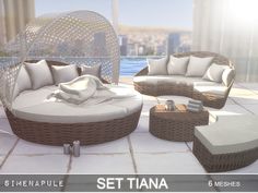 an outdoor lounge set with white cushions and pillows