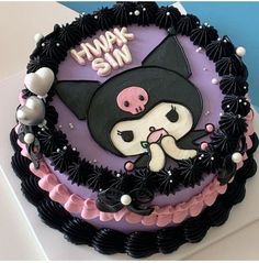 a birthday cake decorated with an image of a cat