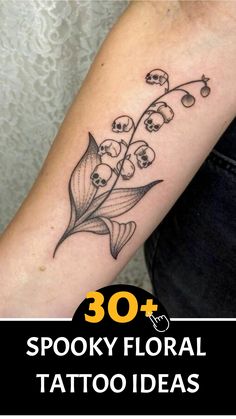 a woman's arm with tattoos on it and the words 30 spooky floral tattoo