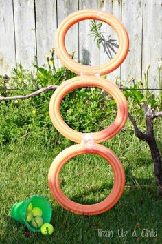 an inflatable ring on the grass near a tree