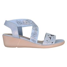 Indulge in the comfort and style of our Rainey Laser sandal, where feminine floral cutouts grace the vamp and playfully scatter across the elastic detailing. Designed for ease with a slip-on-and-go backstrap and stretch elastic cross straps, this sandal envelops your feet in softness. The cushioned memory foam insole ensures a plush experience with every step, while the flexible unit bottom provides cloud-like comfort.Pair these chic sandals with a lightweight linen blouse and relaxed linen trou Comfortable Blue Sandals, Blue Sandals With Arch Support For Summer, Blue Sandals With Removable Insole, Comfortable Slingback Sandals For Beach In Spring, Blue Sandals With Arch Support For Spring, Blue Slingback Sandals For Spring Vacation, Adjustable Sandals With Arch Support For Spring, Spring Slip-on Sandals With Arch Support, Heel Stretch