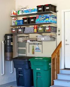 a room with several bins and shelves on the wall