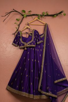 This Purple Kundan Bridal Lehenga Set boasts a stunning raw silk lehenga and blouse, both adorned with intricate zardosi, kundan, and sequin work. The set is completed by a complementary net dupatta embellished with sequins and kundan work. Ready to Ship: From XS to L with in 3 days Delivery: This piece will take 4-6 weeks to produce after we have received your sizing. If you require this earlier, please enquire prior to placing your order to see if this possible. Sizing: Once your order is plac Traditional Dresses Indian, Silk Bridal Lehenga, Lehenga And Blouse, Purple Lehenga, Gold Lehenga, Lehenga Saree Design, Raw Silk Lehenga, Kundan Work