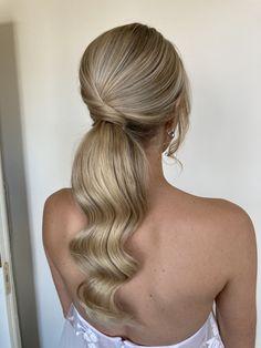 Is a ponytail formal enough for a bride to wear on her wedding day? Take a look at these gorgeous styles and decide for yourself! Hair Looks Ponytail, Bridal Ponytail Long Hair, Wedding Hair With Ponytail, Modern Ponytail Hairstyles Wedding, Soft Wedding Ponytail, Wedding Ponytail Accessories, Bridesmaid Hair Sleek Ponytail, Bridal Hairstyles Low Ponytail, Simple Wedding Hairstyles Ponytail