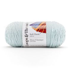 a ball of yarn that is light blue