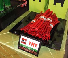 there are some red candy sticks on the table with minecraft name tags in front of them