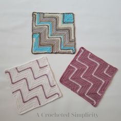 three crocheted coasters sitting next to each other