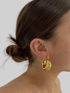 *PLEASE NOTE the Chunky Dome Hoops in gold will not ship or be fulfilled for store pickup until May 8th* 1 1/4" diameter, 20mm wide (at the widest point) hollow dome hoop. Comfortably lightweight. Rich dark gold in color. 18k gold, durably plated over stainless steel. Hypoallergenic. Tarnish resistant jewelry you don’t have to take off. Extended wear while maintaining its gold finish & not turning you green. To give jewelry its longest life possible, please take care of it properly. Barrister Babu, Thick Gold Hoops, Going For Gold, Gold Rush, Dark Gold, Womens Clothing Stores, Gold Hoops, Gold Plated Jewelry, Gold Finish