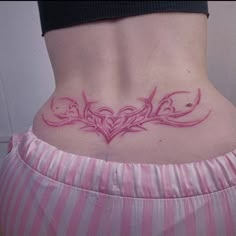 a woman's stomach with an intricate tattoo design on her lower back and side