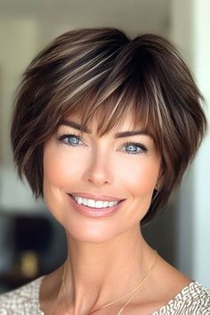 Save this pin for the best short layered haircuts with bangs. This chic pixie cut offers a perfect blend of edgy and refined. The layers are cut to create a piecey, textured look. Wispy bangs softly graze the brows. Short Haircut With Wispy Bangs, Luxury Hairstyles, Elegant Short Hair, Shaggy Pixie, 60 Hairstyles, Layered Haircuts With Bangs, Long Shag