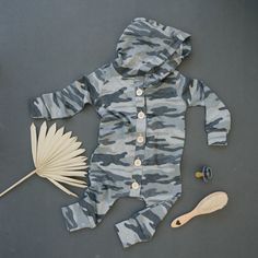 The Play Day romper is a one-piece perfect for all seasons. Mostly winter and spring. This romper features a hoodie and fully functional buttons easy enough for toddlers to put on and off. it is made off our popular super soft baby french terry fabric and makes the cutest little fit on both boys and girls.