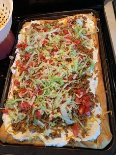 an uncooked pizza sitting on top of a pan