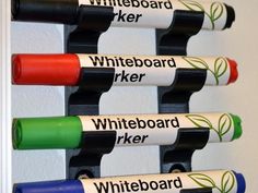 the whiteboard markers are lined up in different colors