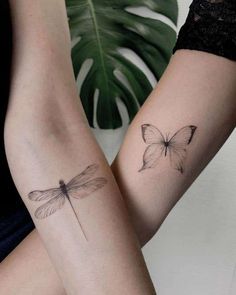 two women with matching tattoos on their arms, one has a butterfly and the other has a dragonfly