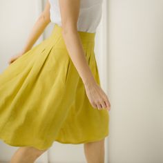 "Yellow Linen Skirt, Linen Retro Skirt, Linen Pleated Skirt Every item is handmade to order and to your personal body measurements (made to measure). DESCRIPTION: -High Waist -Pleats from the waist down -Pockets -Mid Length -Handcrafted Color in the picture- spring yellow and green grey. Other colors are available. ETHICALLY MADE. Every linen garment is handmade using the body measurements of the individual customer. No factory use. Every creative and sewing task is fairly rewarded. Material: 10 Pleated Green Full Skirt, Casual Green Pleated Full Skirt, Green Pleated Knee-length Bottoms, Elegant Yellow Pleated Skirt For Summer, Elegant Yellow Pleated Summer Skirt, Elegant Yellow Pleated Bottoms, Summer Green Skirt With Pleated Waist, Fitted Yellow Wrap Skirt, Elegant Yellow Pleated Skirt