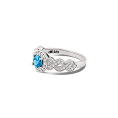 Braided Blue Topaz and Diamond Halo Ring in Sterling Silver Embrace elegance with this exquisite Braided Blue Topaz and Diamond Halo Ring, masterfully crafted in sterling silver. Features a central 5mm round-cut natural blue topaz Surrounded by a halo of 14 natural diamonds (SI1, G color, 1.1mm) Intricate braided band design adorned with 30 natural diamonds (SI1, G color, 1mm) Made from high-quality 925 sterling silver Prong setting for enhanced brilliance 2mm wide band Bottom (or Base) band for a delicate fit Custom engraving available Includes a cleaning cloth, certificate of authenticity (COA), a pouch, and a box Perfect for those who appreciate sophisticated and unique jewelry, this stunning blue topaz and diamond halo ring is ideal for special occasions or everyday wear. Add this beau White Gold Blue Topaz Birthstone Ring For Promise, Sterling Silver Topaz Ring With Accent Stones, Sterling Silver Topaz Ring With Center Stone, Elegant Topaz Ring Birthstone, Elegant Round Topaz Birthstone Ring, Sterling Silver Topaz Ring With Halo Design For Promise, Blue Topaz Ring With Halo Setting In Sterling Silver, Elegant Sterling Silver Topaz Ring With Halo Design, Fine Jewelry Blue Topaz Ring With Halo Design