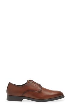 Classic and versatile, this wardrobe-staple leather derby features a plain toe and a rubber tread for traction across all your formal looks. Removable insole Lace-up style Leather upper and lining/rubber sole Imported Business Derby With Stitched Sole And Plain Toe, Business Casual Derby With Stitched Sole And Round Toe, Business Casual Derby Shoes With Stitched Sole, Workwear Plain Toe Oxfords With Stitched Sole, Plain Toe Oxfords With Stitched Sole For Work, Plain Toe Dress Shoes With Stitched Sole For Derby, Workwear Cap Toe Derby With Stitched Sole, Workwear Derby With Stitched Sole And Plain Toe, Leather Shoes For Workwear With Removable Insole